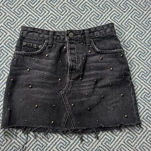 BRAND NEW! Reformation black denim mini skirt with stud detailing.